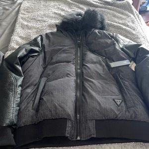 Mens guess puff jacket this is awesome new with tags has damage on sleeves..
